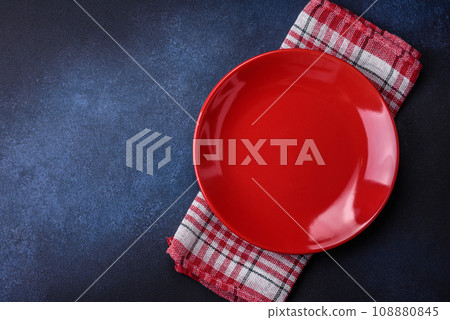 Round empty colored ceramic plate on concrete texture background 108880845