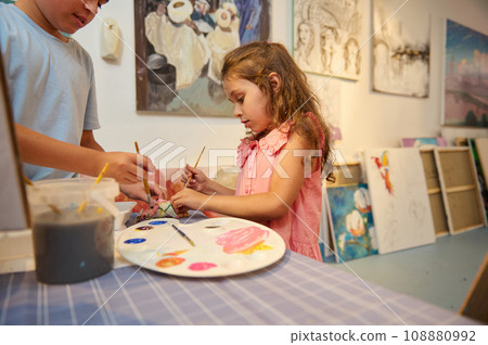 Adorable kids learn drawing in fine art gallery or creative workshop. Painting. Education. Elementary age school 108880992