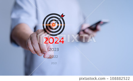 Male hand touching the goal icon from 2021 to 2024 for goal, good health, start up, life balance, plan, learning in new business. Male hand touching the goal icon from 2021 to 2024 for goal, good health, start up, life balance, plan, learning in new business. 108882522