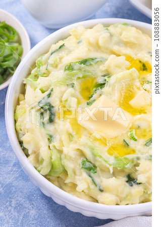 Traditional Irish dish Colcannon or mashed potato with green cabbage and butter, vertical closeup Traditional Irish dish Colcannon or mashed potato with green cabbage and butter, vertical closeup 108883056