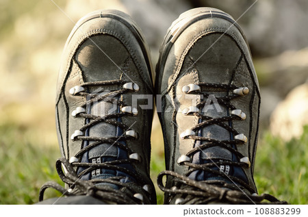 Trekking boots in the mountains Trekking boots in the mountains 108883299
