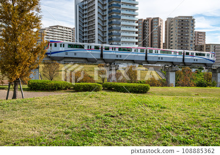 Monorail running beside Saito Nishi Park 108885362