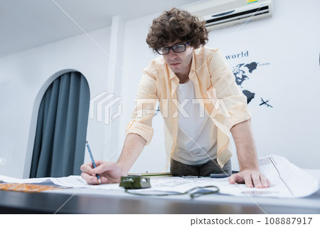 young architect man working drawing house design plan project. 108887917