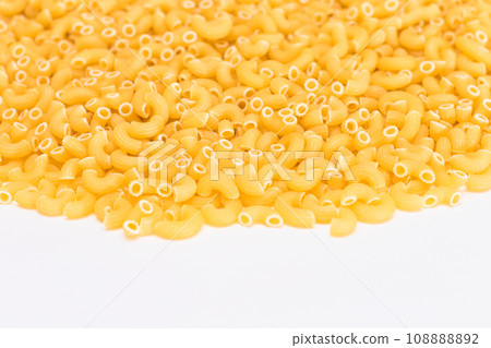 A Heap of Uncooked Chifferi Rigati Pasta on White Background A Heap of Uncooked Chifferi Rigati Pasta on White Background 108888892