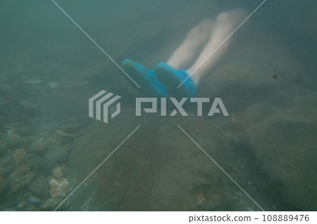 outing to the riverside, playing in a river, feet 108889476