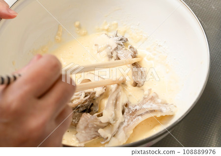 Add tempura batter to maitake mushrooms Add tempura batter to maitake mushrooms 108889976