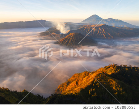 Aerial view Mountains at Bromo volcano during sunrise sky,Beautiful Mountains Penanjakan in Bromo Tengger Semeru National Park,East Java,Indonesia.Nature landscape background Aerial view Mountains at Bromo volcano during sunrise sky,Beautiful Mountains Penanjakan in Bromo Tengger Semeru National Park,East Java,Indonesia.Nature landscape background 108890555