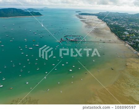 Aerial View Amazing sea with travel boats,sailing boats in the sea,Beautiful sea in summer season at Phuket island Thailand,Travel boats,Ocean during summer blue sky background Aerial View Amazing sea with travel boats,sailing boats in the sea,Beautiful sea in summer season at Phuket island Thailand,Travel boats,Ocean during summer blue sky background 108890597