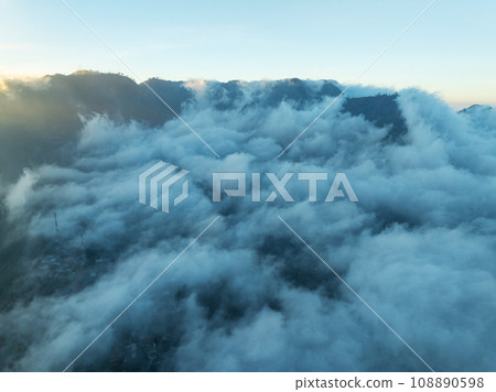 Aerial view Mountains at Bromo volcano during sunrise sky,Beautiful Mountains Penanjakan in Bromo Tengger Semeru National Park,East Java,Indonesia.Nature landscape background Aerial view Mountains at Bromo volcano during sunrise sky,Beautiful Mountains Penanjakan in Bromo Tengger Semeru National Park,East Java,Indonesia.Nature landscape background 108890598