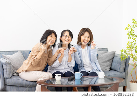 Watching TV, Cheering, Excitement Watching TV, Cheering, Excitement 108892188