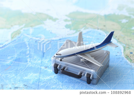 A model of an airplane departing for an overseas trip and a world map A model of an airplane departing for an overseas trip and a world map 108892968