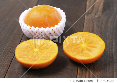 Cross section of Fuyu persimmon Cross section of Fuyu persimmon 108893088