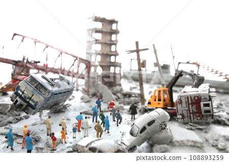 A diorama of a city destroyed by disaster or war and people wandering around. 108893259