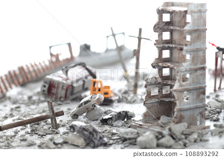 A diorama of a city destroyed by disaster or war and people wandering around. 108893292