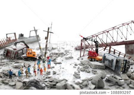 A diorama of a city destroyed by disaster or war and people wandering around. A diorama of a city destroyed by disaster or war and people wandering around. 108893297