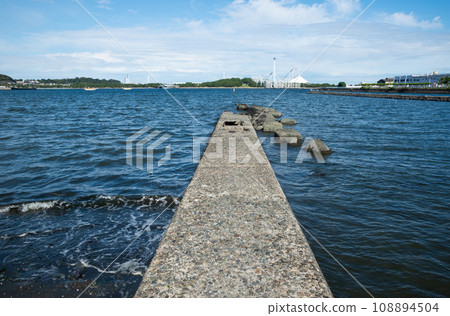 A mysterious breakwater with a view of the amusement park A mysterious breakwater with a view of the amusement park 108894504