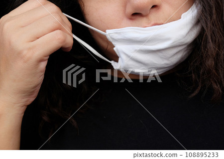 Asian Thai woman wearing a white cloth mask for prevent the Covid-19 or Corona virus and Air Pollution Value Pm 2.5 in Thailand and Epidemic disease around the world. Health and illnes Asian Thai woman wearing a white cloth mask for prevent the Covid-19 or Corona virus and Air Pollution Value Pm 2.5 in Thailand and Epidemic disease around the world. Health and illnes 108895233