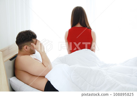 Caucasian lover Couple on the bed unhappy in having sex and have problems in relationship of married life. Wife touchy to her husband. Erectile Dysfunction and Divorce in society concept 108895825