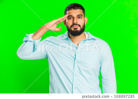 Subordinate responsible Indian man giving salute listening to order as soldier, following discipline Subordinate responsible Indian man giving salute listening to order as soldier, following discipline 108897285