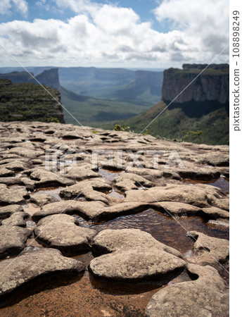 Heart Shaped Rock on Chapada Diamantina's Cliff Overlooking a Valley 108898249