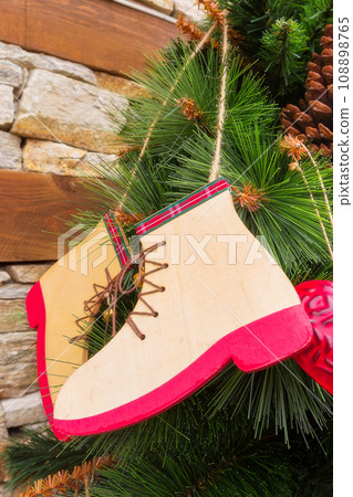 Christmas background with wooden shoes decor Christmas background with wooden shoes decor 108898765