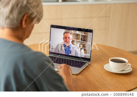 Senior man doctor expert examining older senior woman online. Old woman lady patient and doctor talk on video call have consultation with laptop. Medicine healthcare medical checkup. Online doctor Senior man doctor expert examining older senior woman online. Old woman lady patient and doctor talk on video call have consultation with laptop. Medicine healthcare medical checkup. Online doctor 108899148