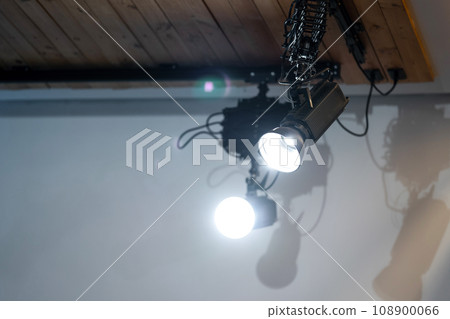 spotlight led is hung on to wood ceiling in the event room. 108900066