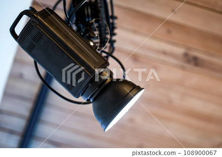 spotlight led is hung on to wood ceiling in the event room. 108900067