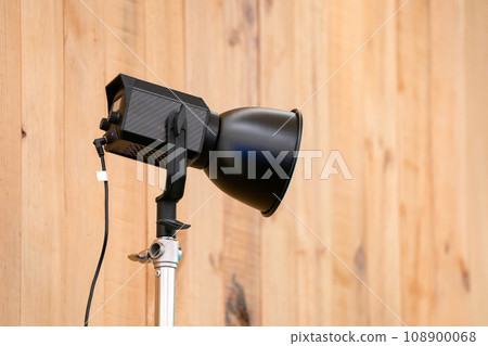 close up to Studio LED sportlight on tripod and standy in the event room. 108900068