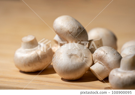 Straw mushroom is prepared on the wood board for ingredient of cooking. 108900095