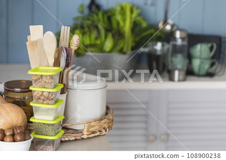 Set of healthy food and stylish accessories on a table in the kitchen, close-up, copy space, selective focus. Set of healthy food and stylish accessories on a table in the kitchen, close-up, copy space, selective focus. 108900238