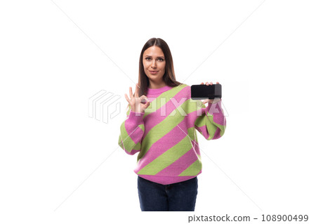 e-business concept. 35 year old feminine model woman dressed in a pink pullover demonstrates the e-business concept. 35 year old feminine model woman dressed in a pink pullover demonstrates the 108900499