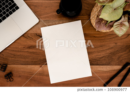 Empty blank white magazine cover mock up, laptop, stationery and cup of tea, houseplant flat lay on wood desk office. 108900977