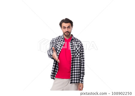 handsome smart young european man with black hair and unshaven beard in shirt 108902250