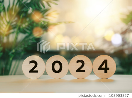 Wood block circle with 2024. Happy New Year. Merry Christmas. Goal planning idea. Popular trends. Wood block circle with 2024. Happy New Year. Merry Christmas. Goal planning idea. Popular trends. 108903837
