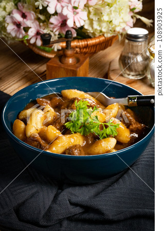 Beef stew in gravy. 108903925