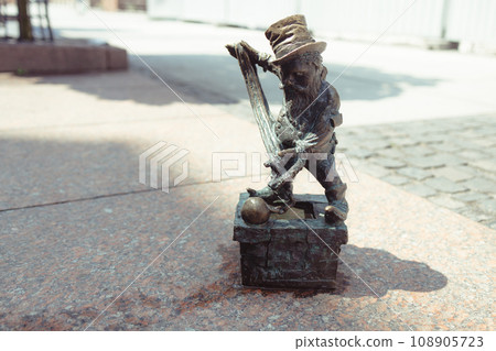 Small dwarf statue on the market square in Wroclaw Small dwarf statue on the market square in Wroclaw 108905723