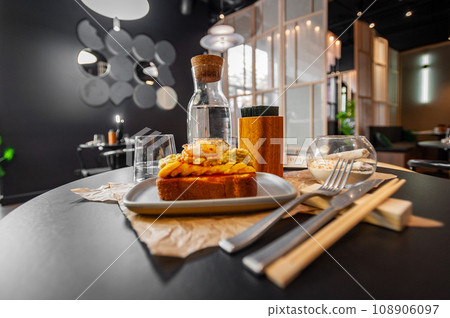 Croque Madame hot french sandwich with ham, melted cheese, fried egg and sauce. Croque Madame hot french sandwich with ham, melted cheese, fried egg and sauce. 108906097