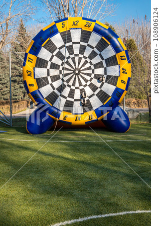 Large inflatable target for team building games and outdoor competitions, vertical copy space Large inflatable target for team building games and outdoor competitions, vertical copy space 108906124