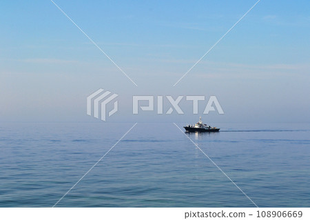 Baltiysk, Kaliningrad region, Baltic spit, ship in the Baltic Sea, water surface to the horizon Baltiysk, Kaliningrad region, Baltic spit, ship in the Baltic Sea, water surface to the horizon 108906669