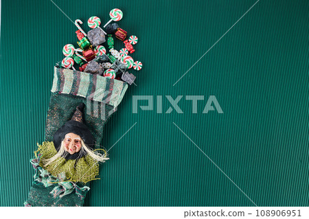 The Befana with sweet coal and candy. Italian Epiphany day tradition. The Befana with sweet coal and candy. Italian Epiphany day tradition. 108906951