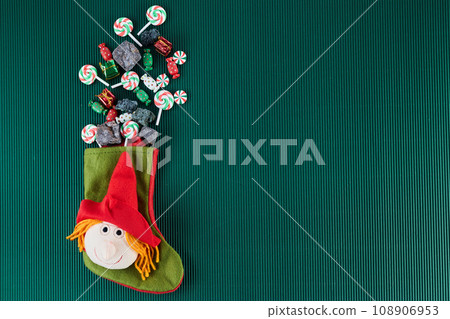 The Befana with sweet coal and candy. Italian Epiphany day tradition. 108906953