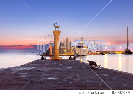 View of the city embankment in night lighting at dawn. Rhodes. 108907029