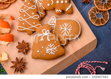 Beautiful festive Christmas composition of tangerines, gingerbread and star anise Beautiful festive Christmas composition of tangerines, gingerbread and star anise 108907462