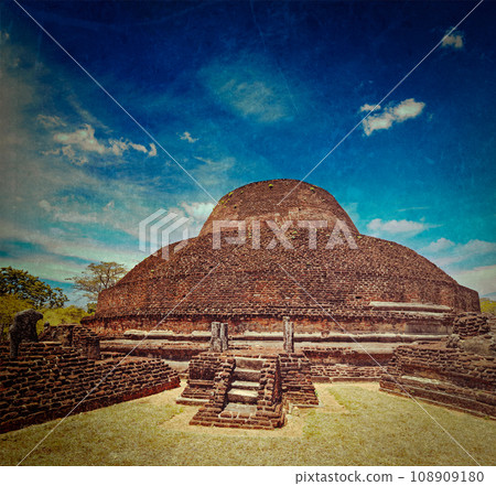 Vintage retro hipster style travel image of ancient Buddhist dagoba (stupe) Pabula Vihara with grunge texture overlaid. Ancient city of Polonnaruwa, Sri Lanka Vintage retro hipster style travel image of ancient Buddhist dagoba (stupe) Pabula Vihara with grunge texture overlaid. Ancient city of Polonnaruwa, Sri Lanka 108909180