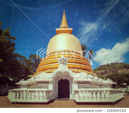 Vintage retro hipster style travel image of buddhist dagoba (stupa) close up with grunge texture overlaidin Golden Temple, Dambulla, Sri Lanka 108909188