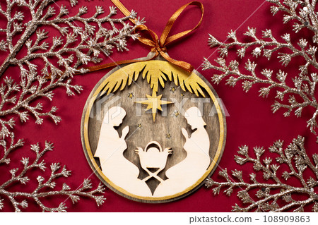 Wooden christmas creche on a wooden background. Christmas tree decoration 108909863