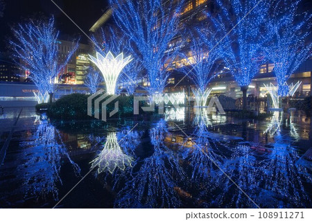 Illuminations reflected in a puddle Illuminations reflected in a puddle 108911271