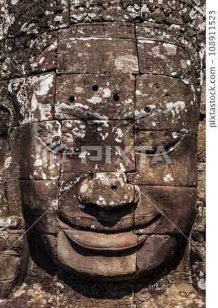 Ancient stone face of Bayon temple, Angkor, Cambodia 108911523