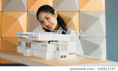 Skilled architect holds architect model while check mistake point. Manipulator. 108911547